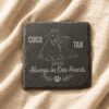 Custom Slate Pet Memorial Coaster – Always in Our Hearts Personalized square slate pet memorial coaster engraved with a dog and cat illustration, resting on soft beige linen fabric.
