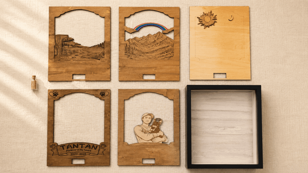 Exploded view of a personalized layered wooden pet memorial shadow box showing individual laser cut components, engraved layers, frame, and keepsake vial.