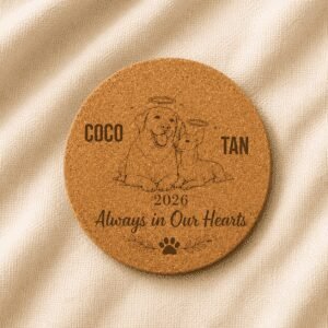 Personalized round cork pet memorial coaster featuring custom engraved dog and cat portraits, pet names, memorial year, and the quote “Always in Our Hearts,” displayed on a soft linen background.
