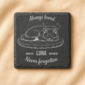 Personalized square slate pet memorial coaster featuring an engraved sleeping cat with angel halo, custom name Luna, memorial years 2011–2026, and the message “Always Loved, Never Forgotten,” displayed on a soft cream linen background.